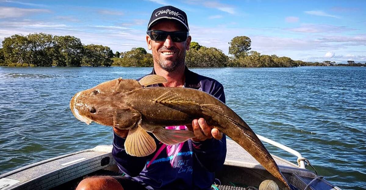FLAT OUT: Randy Keeble with a Brisbane River flathead. These beauties have been caught in a variety of locations.