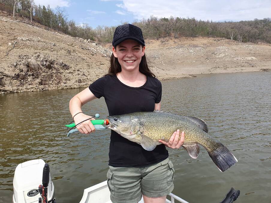 GOOD COD: Caitlyn May with a 75cm cod she caught and released from Glenlyon Dam.