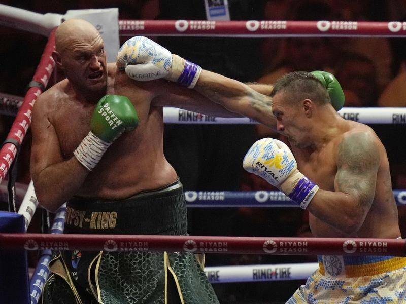 Tyson Fury (l) and Oleksandr Usyk (r) will trade blows again on December 21 in Saudi Arabia. (AP PHOTO)