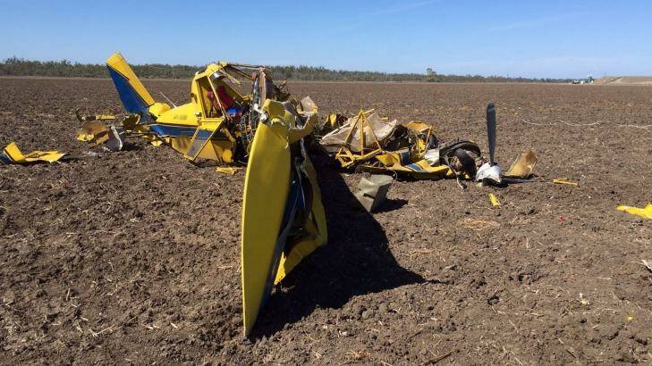 The agricultural aircraft has crashed after coming into contact with power lines Photo: RACQ LifeFlight Rescue