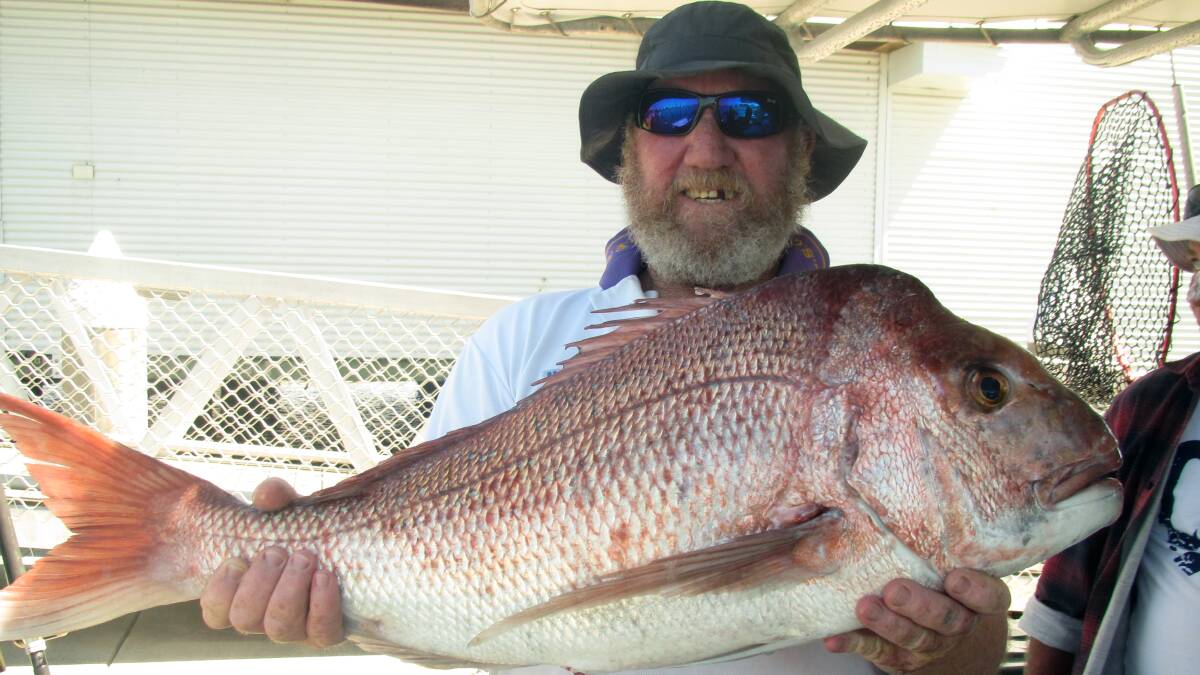 Dan Coonan with an 8kg snapper caught off Moreton Island onboard Frenzy Charters