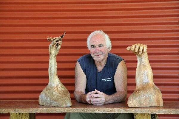 Macleay Island sculptor Ted Upton is one of the artists appearing at the Artists at Work event over Easter. Ted is pictured with his sculptures, Adam and Eve, which were carved from the trunk of a weeping fig tree, which was felled on Macleay Island for safety reasons. 