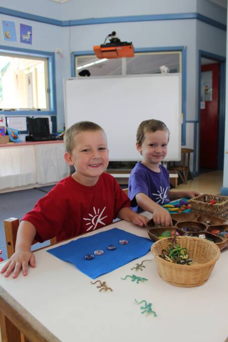 Slithery escape... Carbrook kindy kids Koby McGarrity, 4, and Rory Burns, 4, were passed out a window when a deadly eastern brown snake slithered into their classroom. Photo by Shannon Holloway